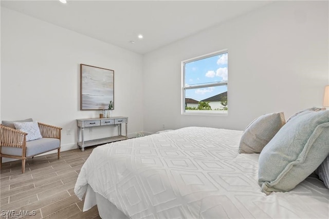 bedroom with light hardwood / wood-style flooring