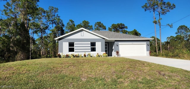 view of front of property featuring a front yard and a garage