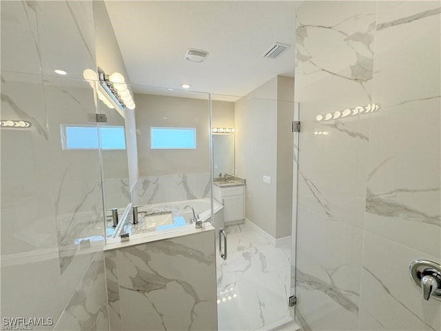 bathroom featuring vanity and a shower with shower door