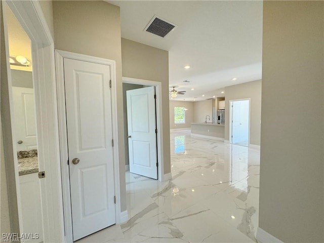 hallway featuring sink