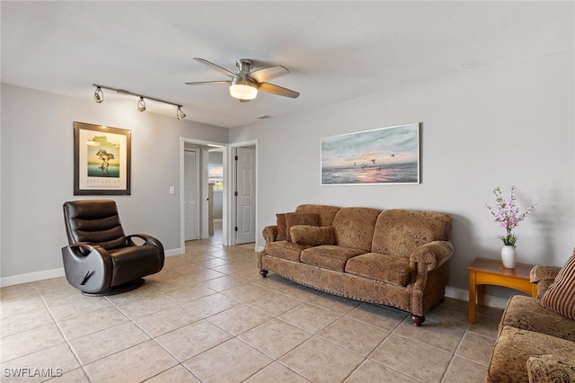 living room featuring ceiling fan and light tile patterned flooring