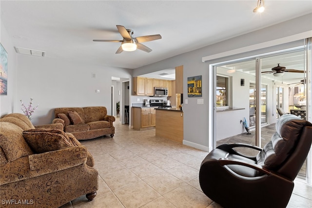 tiled living room featuring ceiling fan