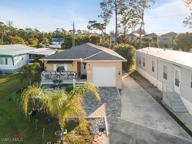 view of front of house with a front yard and a garage