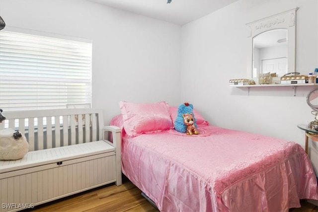 bedroom with wood-type flooring