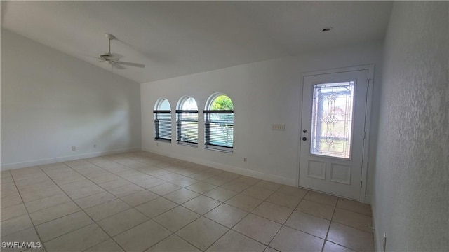 entryway with ceiling fan and light tile patterned floors