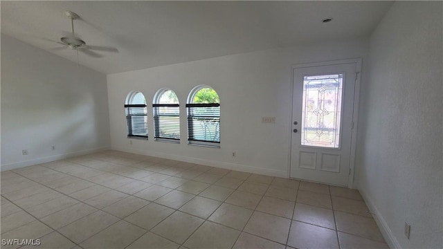 entrance foyer with ceiling fan and light tile patterned flooring