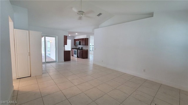 spare room with light tile patterned floors, ceiling fan, and lofted ceiling