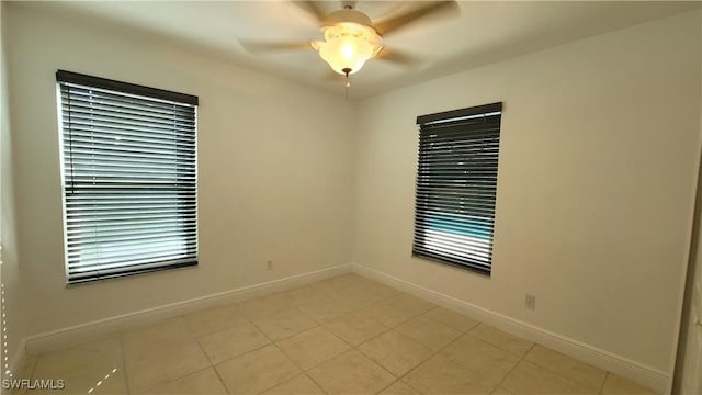 spare room with ceiling fan