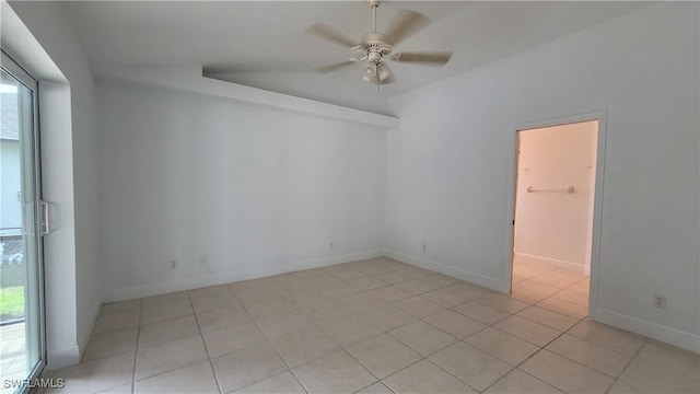 empty room featuring ceiling fan and light tile patterned flooring