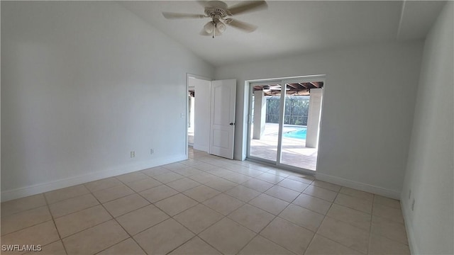 unfurnished room with ceiling fan, light tile patterned floors, and vaulted ceiling