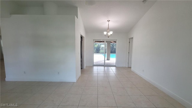 unfurnished room with light tile patterned floors and a notable chandelier