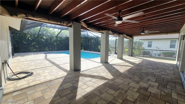 view of pool featuring a lanai, ceiling fan, and a patio area