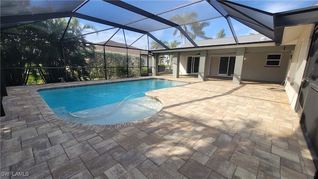 view of pool featuring a lanai and a patio