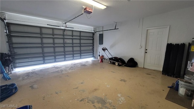 garage featuring electric panel and a garage door opener