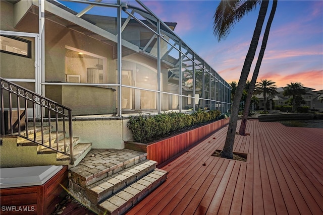 property exterior at dusk with a lanai