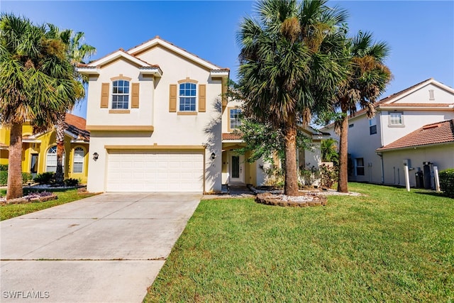 mediterranean / spanish-style home featuring a front yard and a garage