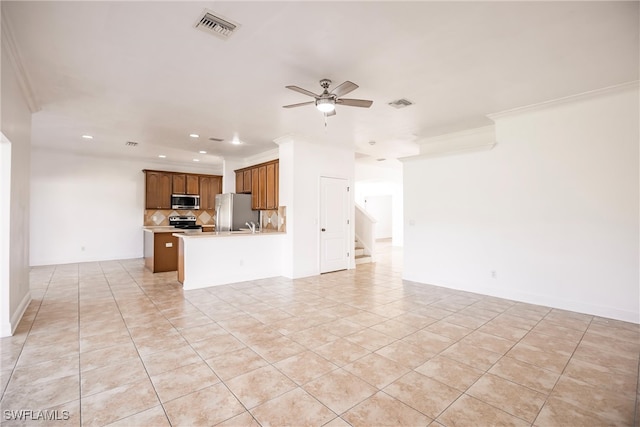 unfurnished living room with ceiling fan, light tile patterned flooring, and ornamental molding