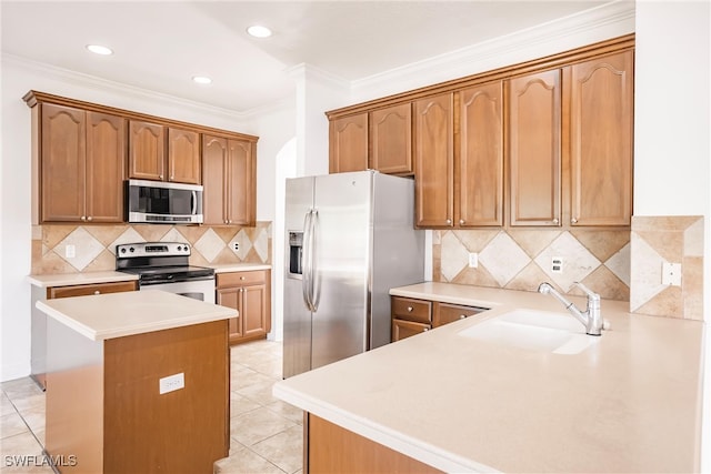 kitchen featuring sink, crown molding, decorative backsplash, light tile patterned floors, and appliances with stainless steel finishes