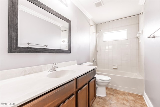 full bathroom featuring vanity, toilet, crown molding, and tiled shower / bath