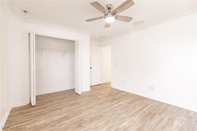 unfurnished bedroom with ceiling fan, a closet, ornamental molding, and light hardwood / wood-style flooring