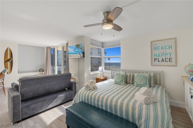 bedroom featuring light wood-type flooring and ceiling fan