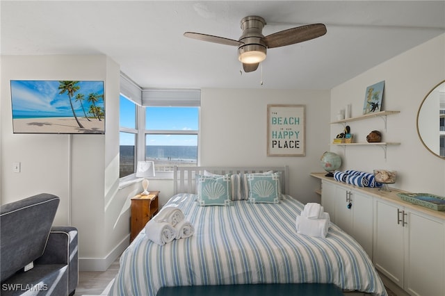 bedroom featuring ceiling fan and light hardwood / wood-style flooring