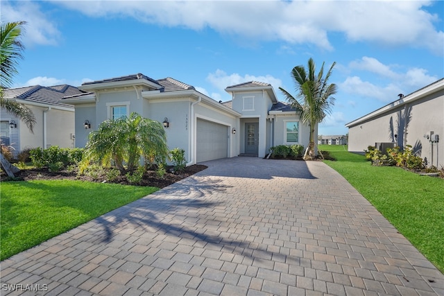 view of front facade with a front lawn and a garage