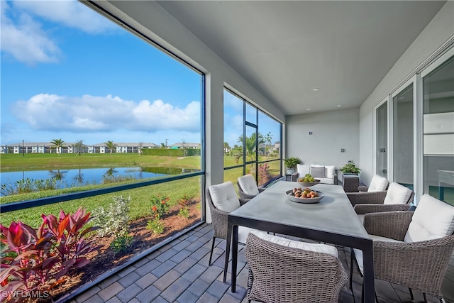 sunroom with a water view