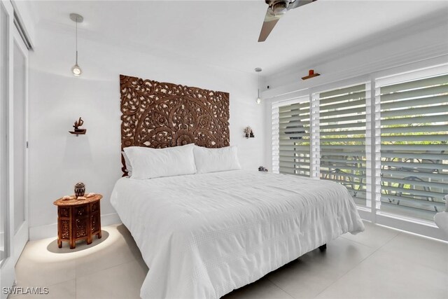 bedroom with access to outside, tile patterned floors, and ceiling fan