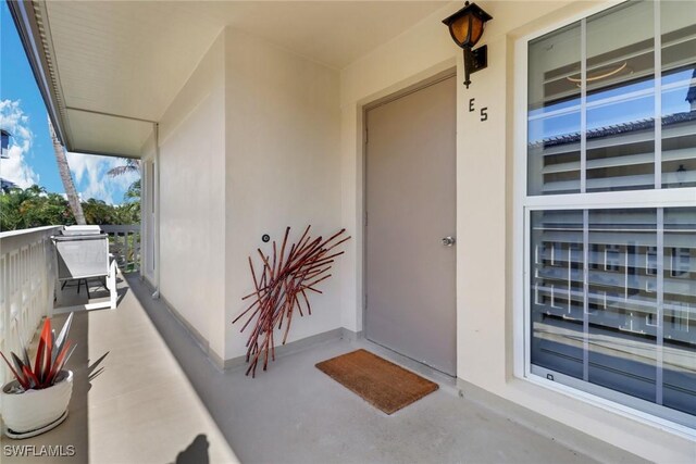 doorway to property featuring a balcony