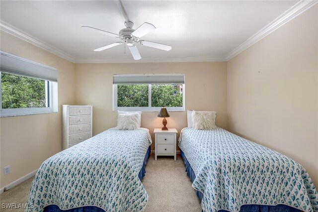 bedroom with ceiling fan, light colored carpet, and ornamental molding