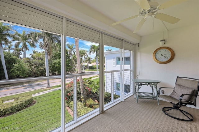 sunroom with ceiling fan and a wealth of natural light