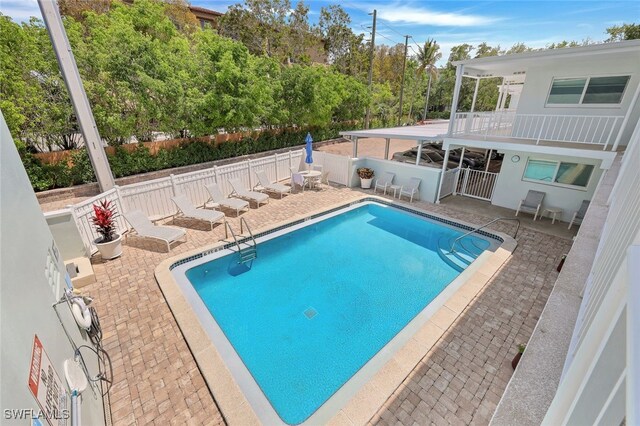 view of swimming pool with a patio