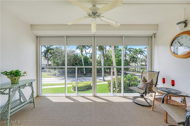 sunroom with a ceiling fan and a wealth of natural light