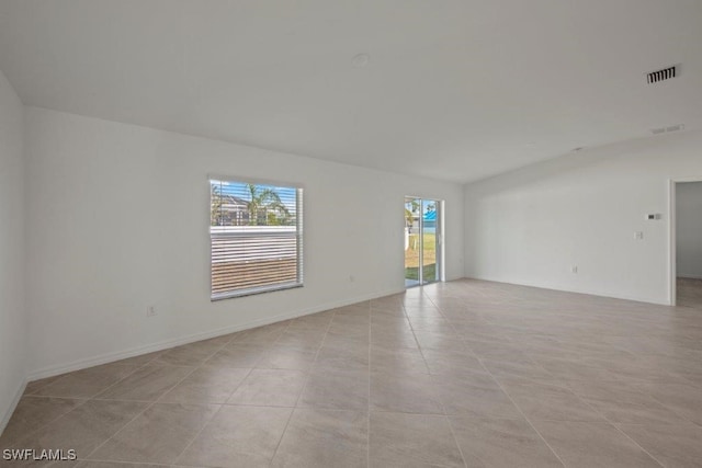 spare room with light tile patterned floors