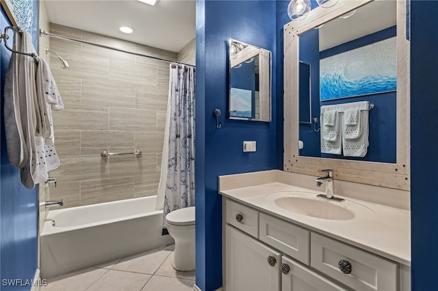 full bathroom with tile patterned floors, shower / bath combo with shower curtain, vanity, and toilet