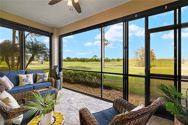 sunroom with ceiling fan