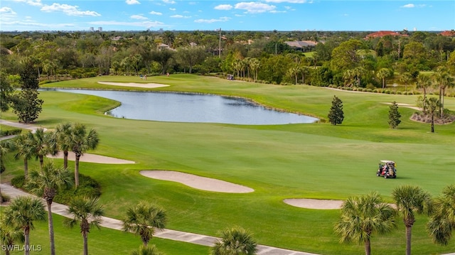 view of home's community featuring golf course view and a water view