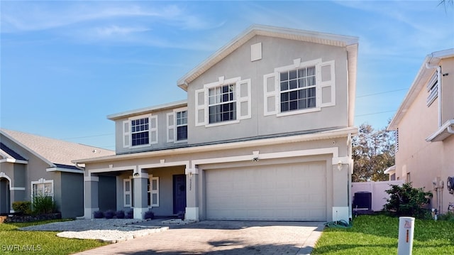 view of front facade featuring covered porch, a garage, and a front yard