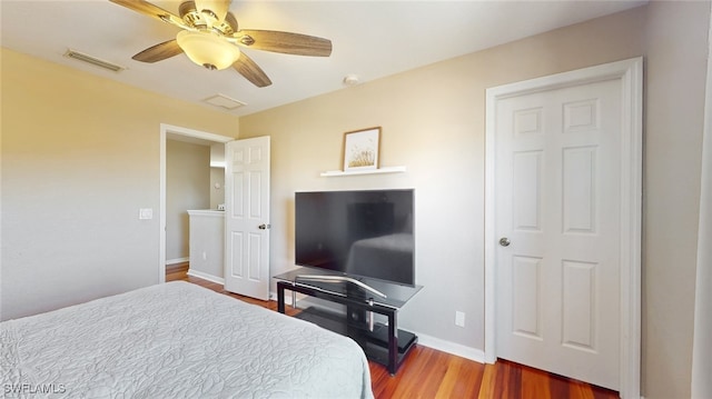 bedroom featuring ceiling fan and hardwood / wood-style flooring