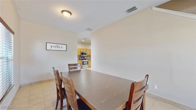 dining room featuring light tile patterned flooring