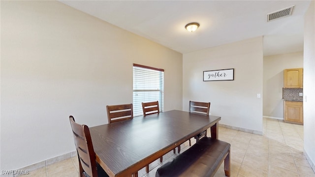 dining room with light tile patterned flooring