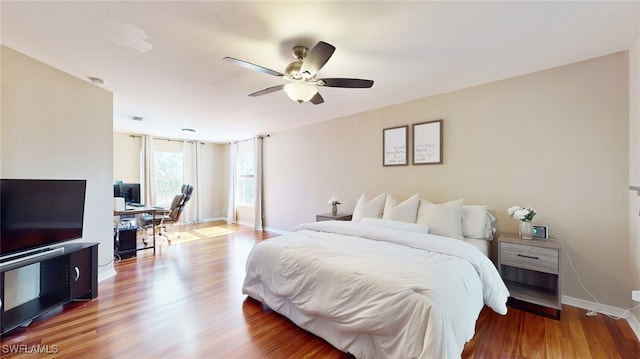 bedroom featuring wood-type flooring and ceiling fan