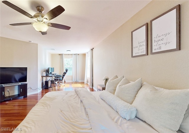 bedroom featuring ceiling fan and hardwood / wood-style floors