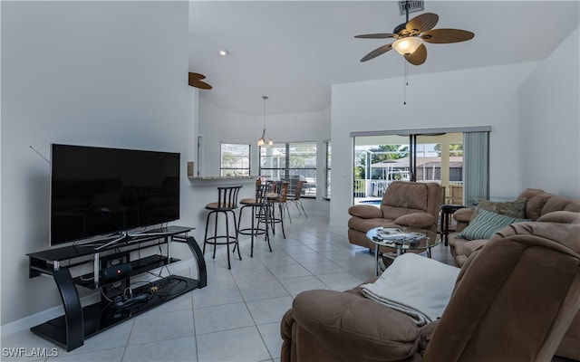 tiled living room with ceiling fan