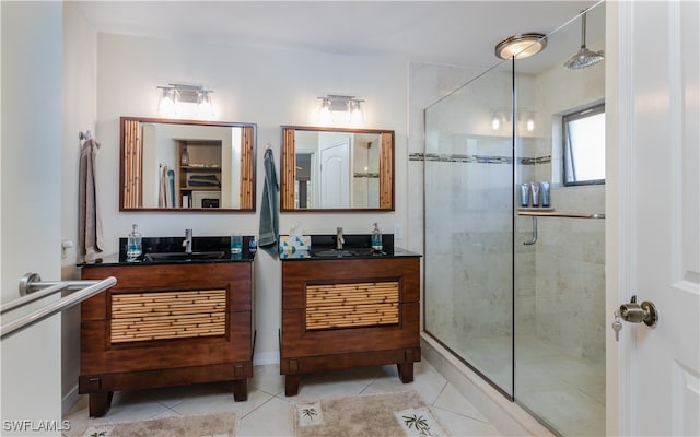 bathroom with vanity, tile patterned floors, and a shower with shower door