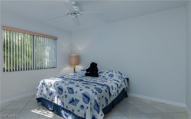 tiled bedroom with ceiling fan