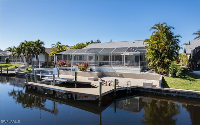 dock area featuring glass enclosure and a water view