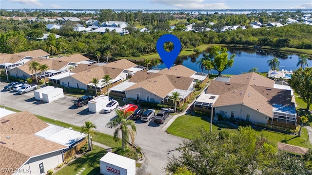 birds eye view of property featuring a residential view and a water view