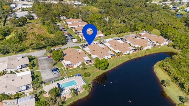 drone / aerial view featuring a water view and a residential view